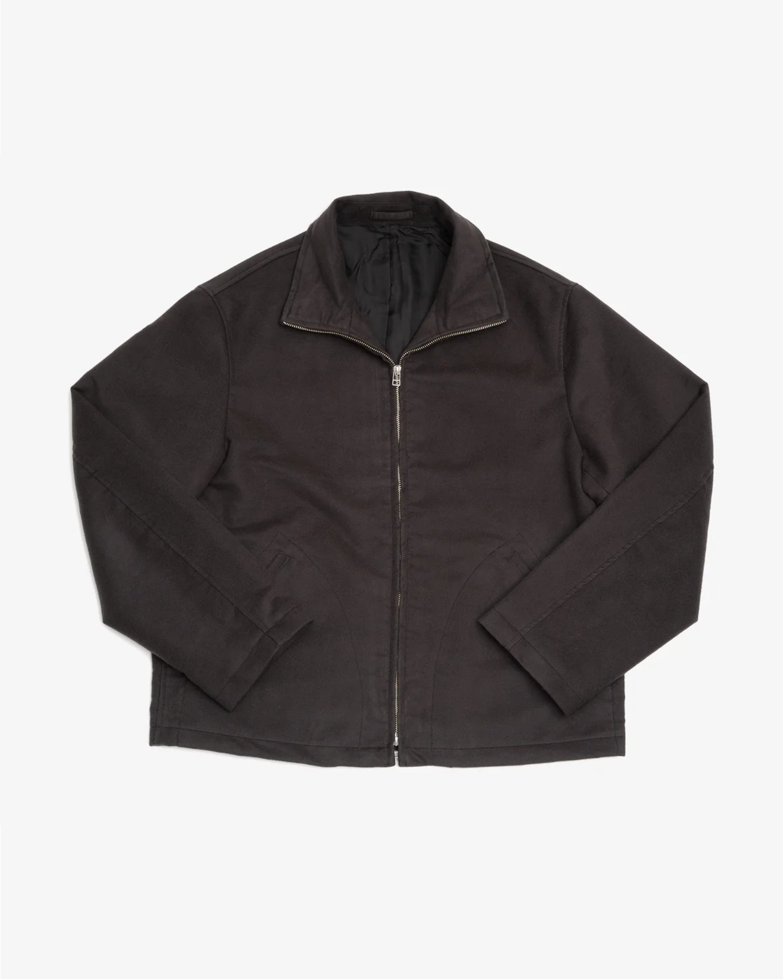 The James Coward Circuit Jacket in Charcoal, crafted in Vancouver from premium Japanese cotton moleskin, features a collar, long sleeves, and side pockets. Shown laid flat on a white background.