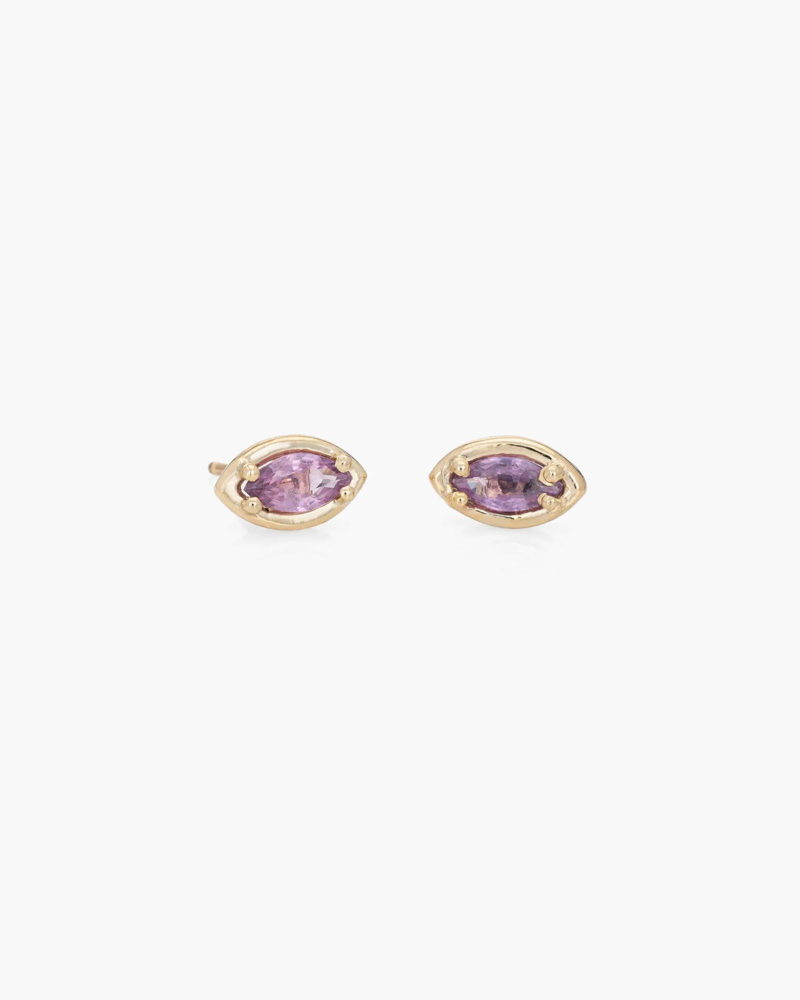 The Kathryn Bentley Marquise Studs Pair features pink sapphires set in open 14K yellow gold frames, shown against a plain white background.