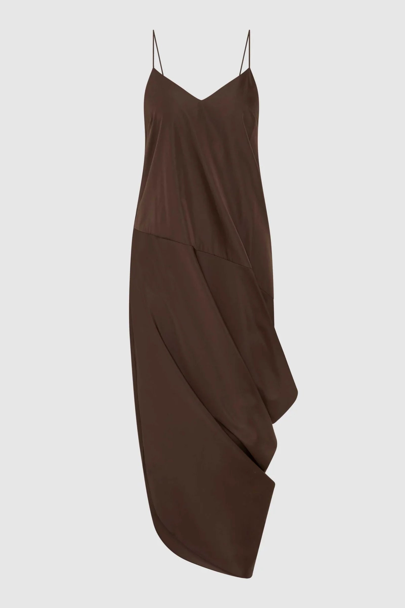 The ST. AGNI Paper Taffeta Drape Dress in Mocha is a sleeveless, dark brown recycled polyester dress featuring thin spaghetti straps, an asymmetrical hemline, and draped detailing on one side, shown against a plain light background.