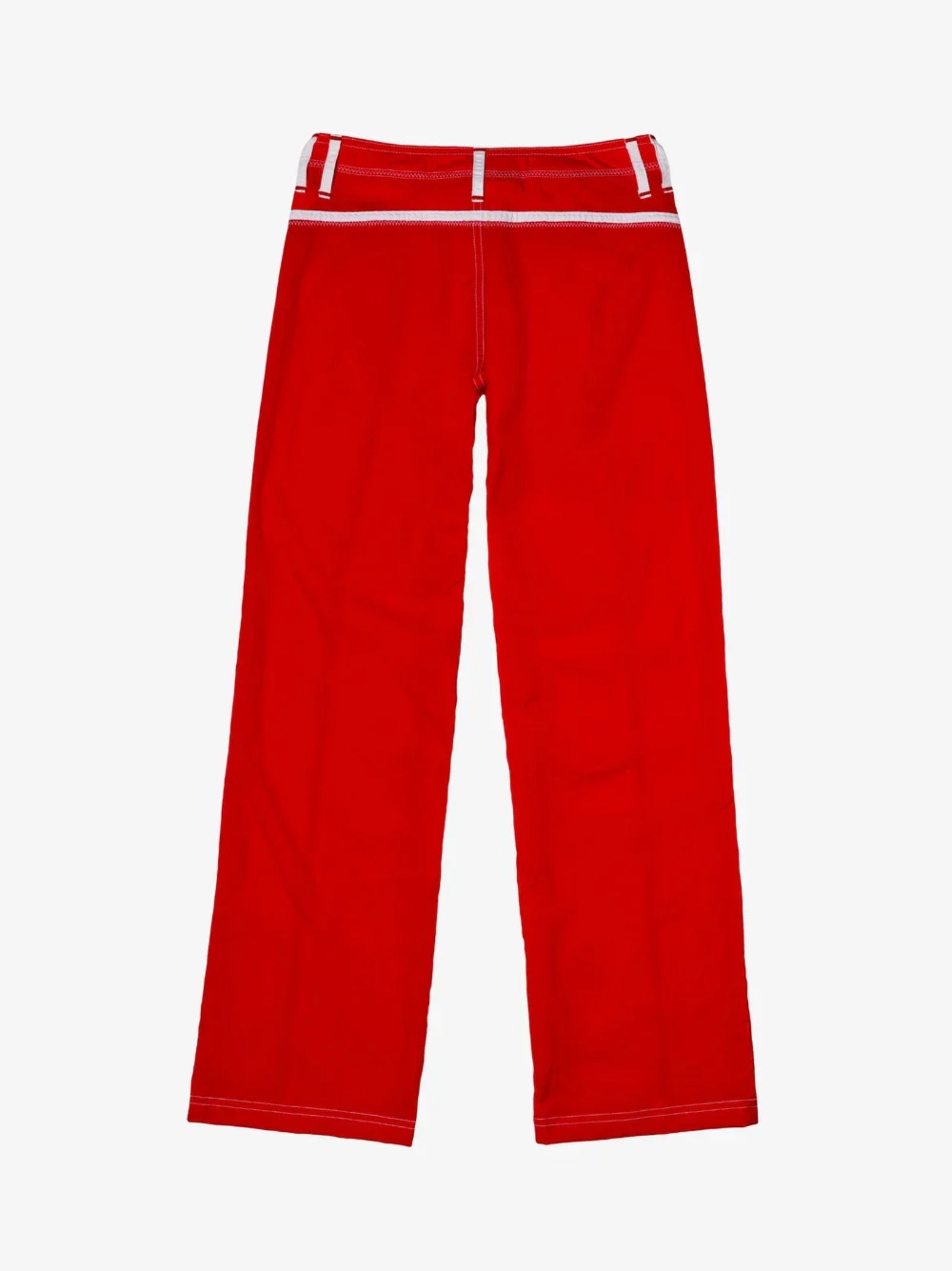 Pant in Red/White by Made Some Sportswear shown laid flat on a white background. These vintage-inspired athletic pants feature bright red fabric with white belt loops and stitching, and offer a relaxed, straight-leg fit for retro style and everyday comfort.