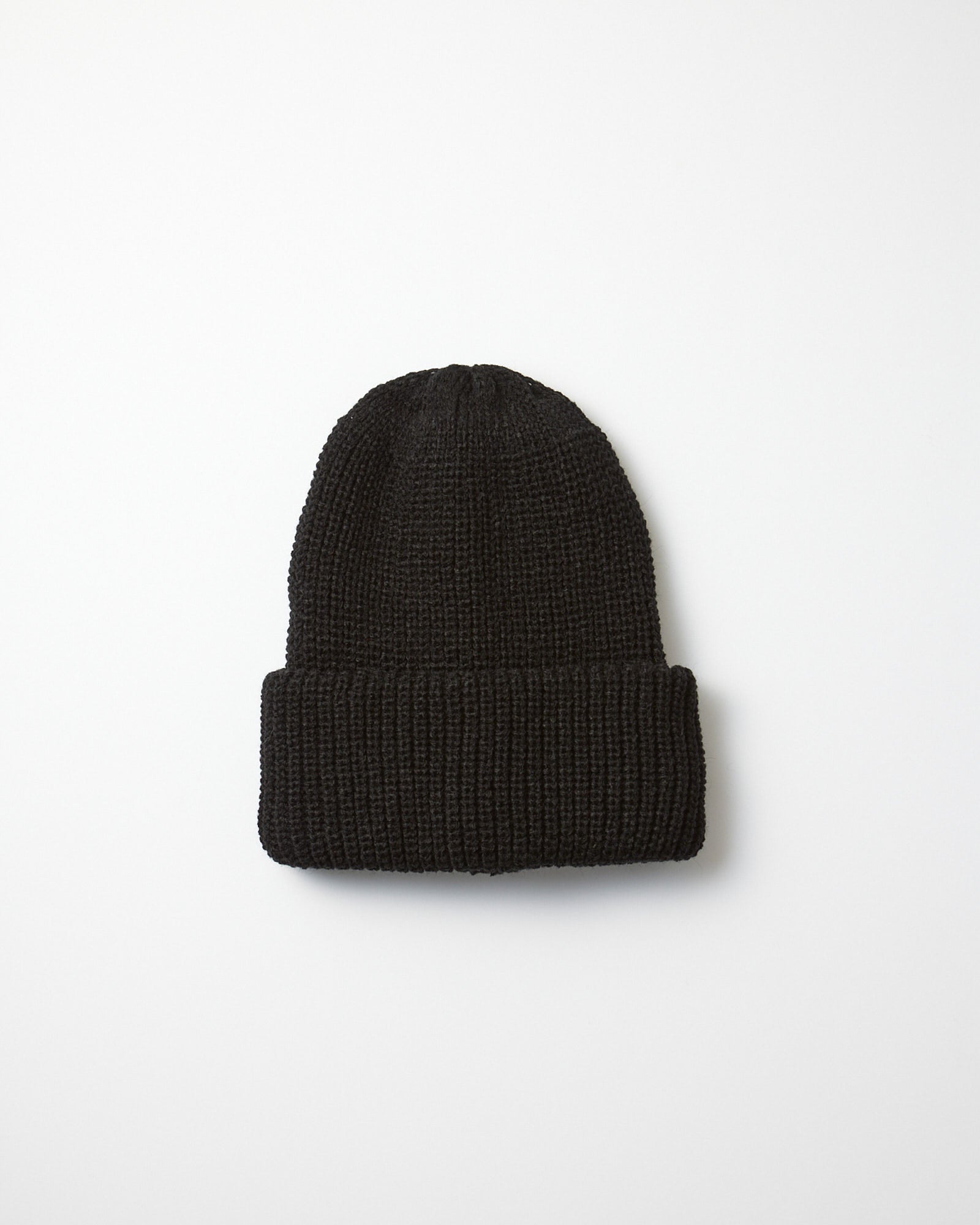 The 5075 Chunky Beanie in Black by Rototo, featuring a folded brim, is displayed on a plain white background.