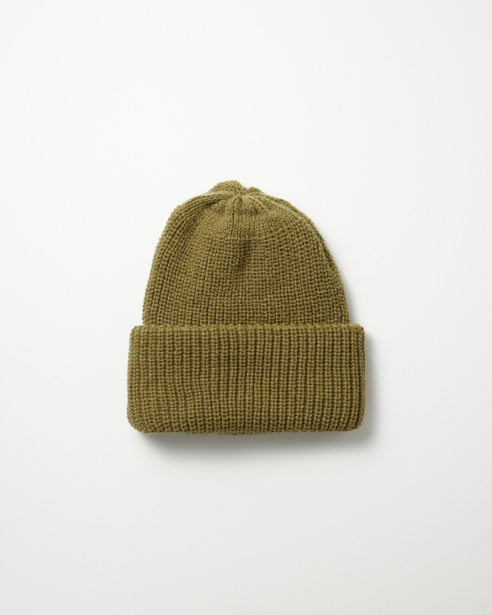 The Rototo 5075 Chunky Beanie in Light Olive features anti-pilling knit construction and a folded brim, shown laid flat on a plain white background.