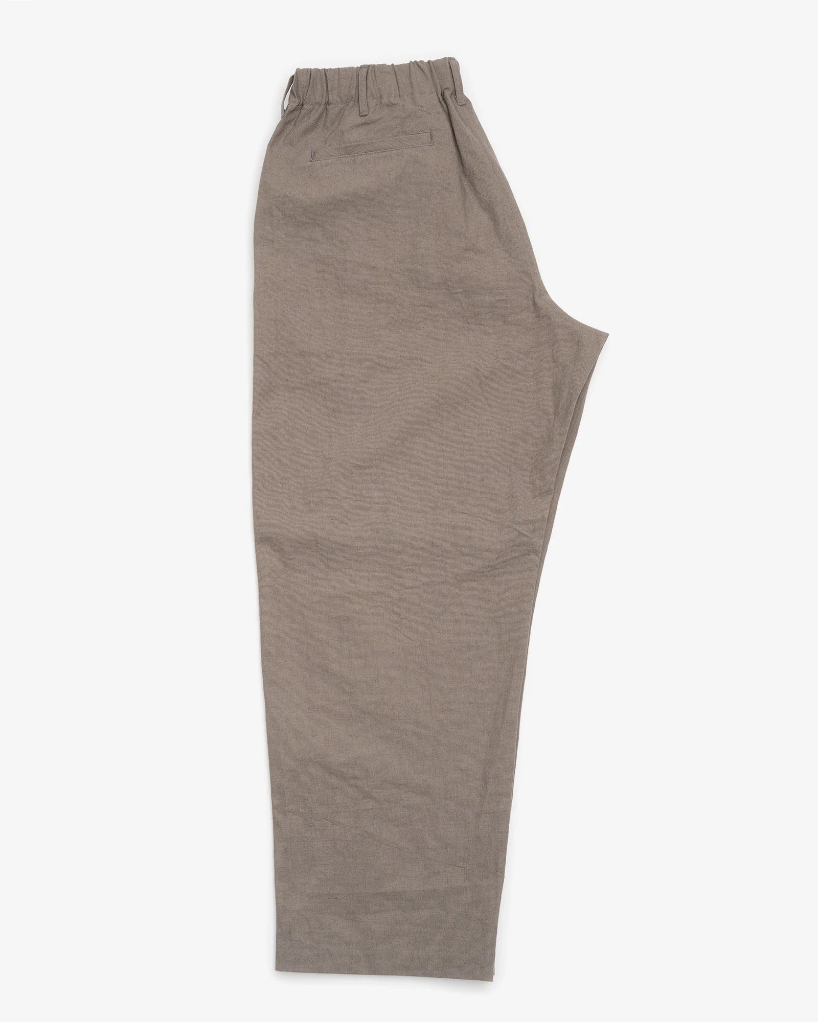 Loose-fitting James Coward Carry On Pant in Mid Grey with an elastic waistband and a slightly wrinkled texture, laid flat on a white background. These pants provide a relaxed, casual style.