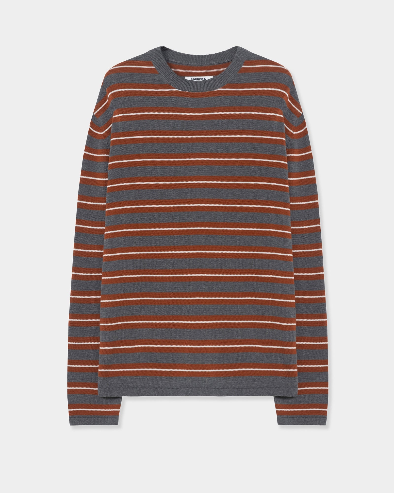 Here’s a rewritten sentence using your product data: The CORDERA Striped Long Sleeve Tee in Multi, crafted from organic cotton, features horizontal gray, brown, and orange stripes with solid gray detailing at the neckline, cuffs, and hem. This cozy tee is displayed flat against a plain white background.