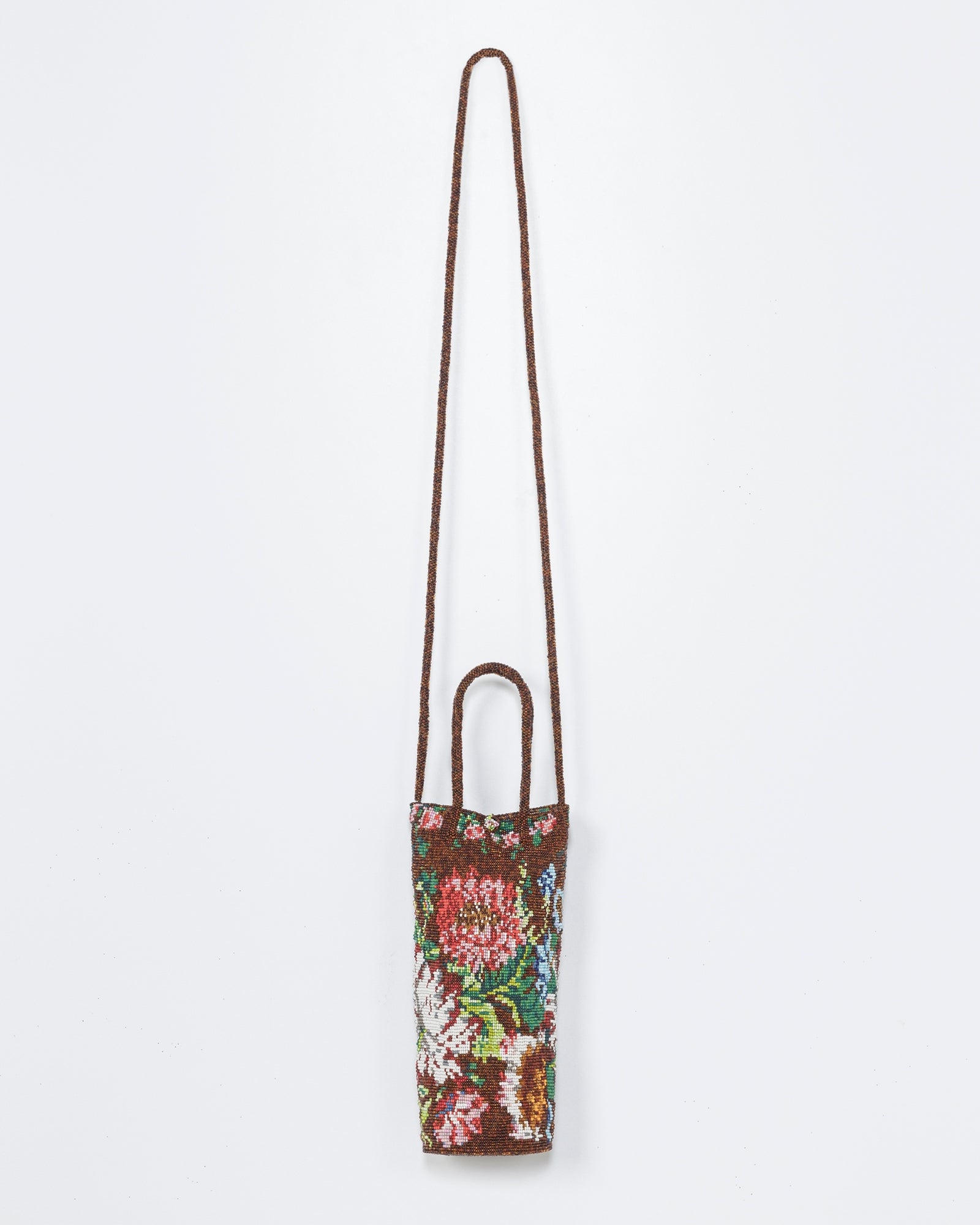 The Cordera Handmade Beaded Bag in Peonia features a floral design, long brown strap, and two short handles, shown against a plain white background.