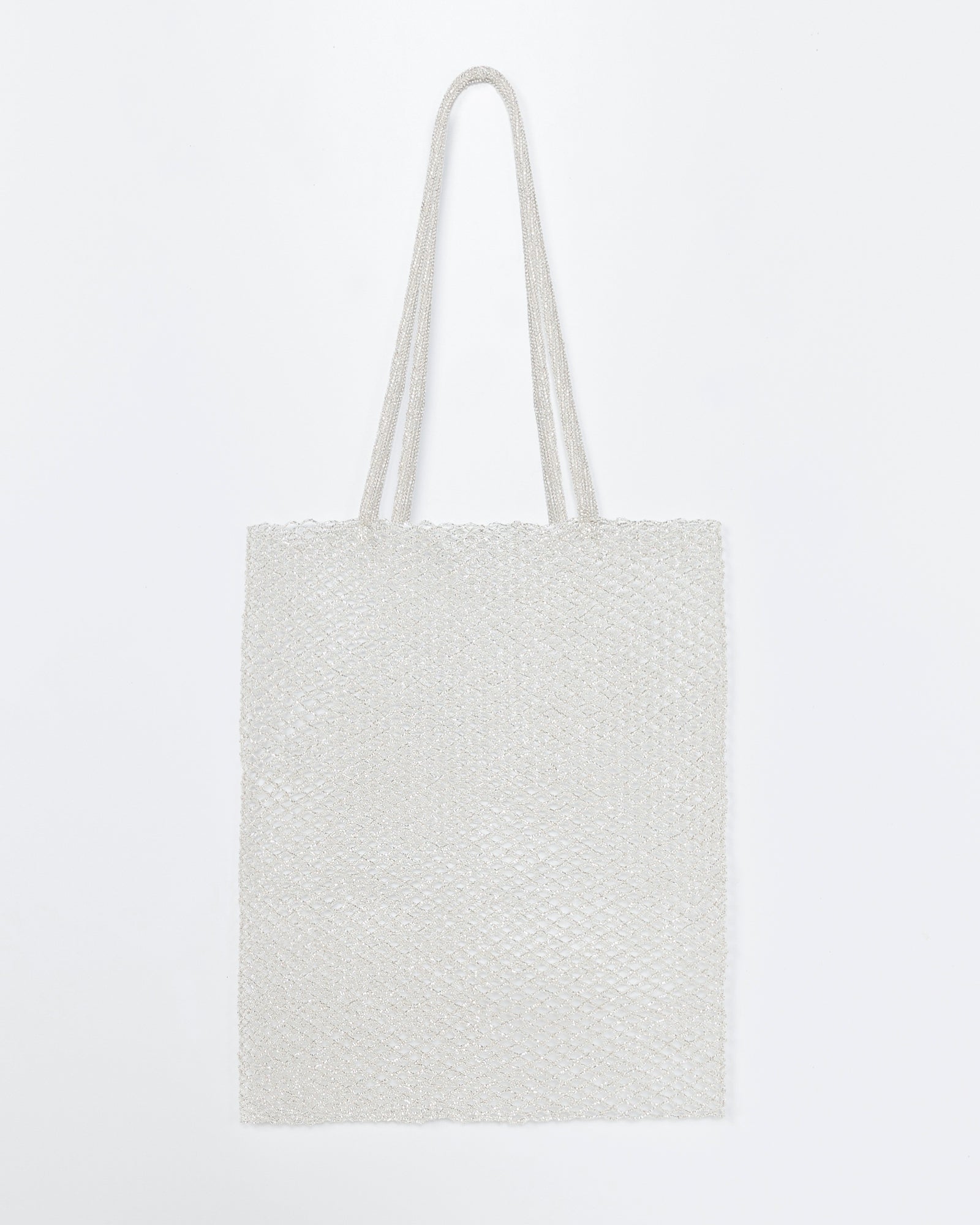The Cordera Beaded Tote Bag in Silver features a simple rectangular design with two long, thin handles, shown against a plain white background.