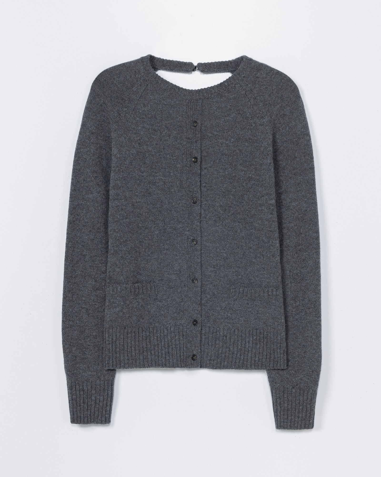 The CORDERA Merino Wool Open Back Cardigan in Grey features long sleeves, a button-up front, ribbed cuffs and hem, and a round neckline. For sizing or fit questions, contact us via online chat. Displayed flat against a white background.