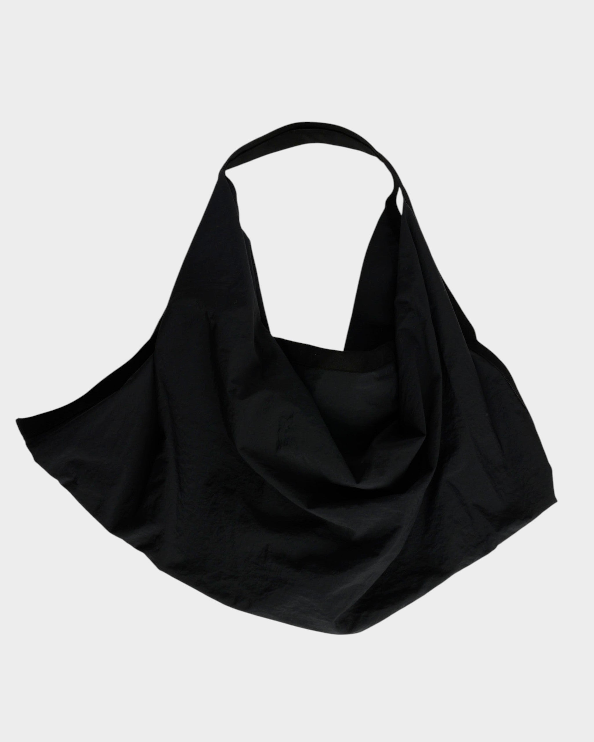 Mohawk General Store black nylon slouchy tote bag with a wide shoulder strap on a white background