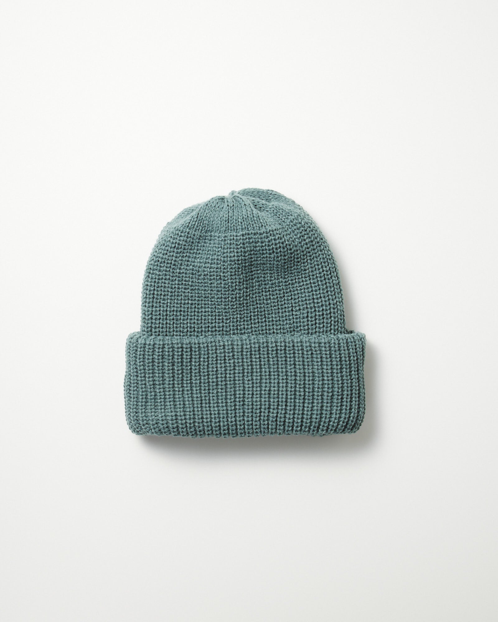 A Rototo 5075 Chunky Beanie in Cadet Blue, featuring a folded brim and oversized fit, is displayed flat on a white background. Made in Japan, it blends comfort with quality craftsmanship.