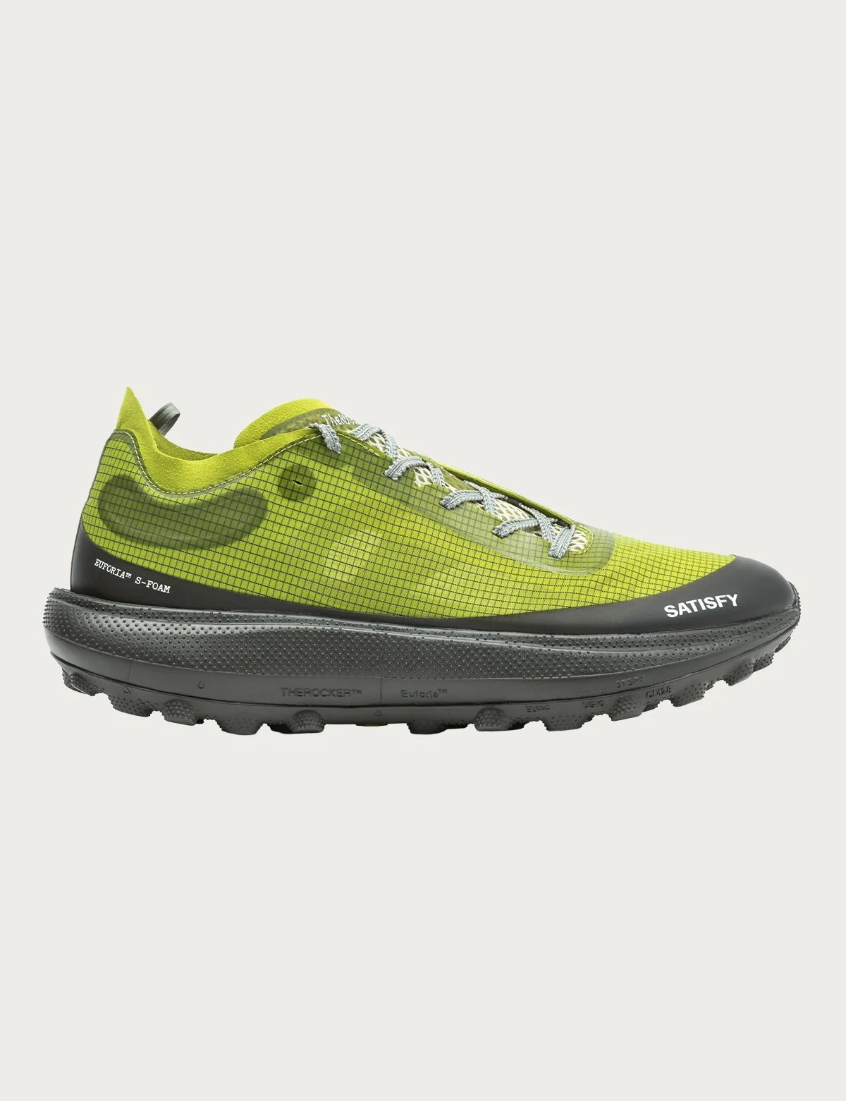 A trail shoe in Grenoble Green with a mesh upper, patterned laces, and thick textured sole featuring Vibram Megagrip for traction. “Satisfy Running” and “The Rocker in Grenoble Green” are printed on the side near the sole.