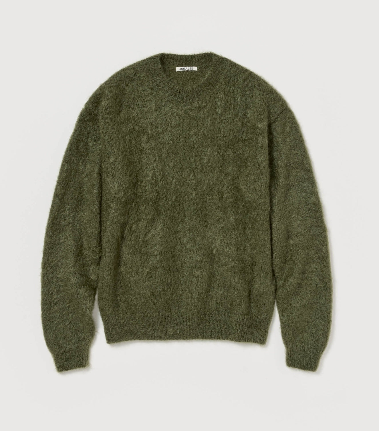 The Auralee Brushed Super Kid Mohair Pullover in Olive, a fuzzy long-sleeve sweater with a crew neckline, is displayed flat on a light background.