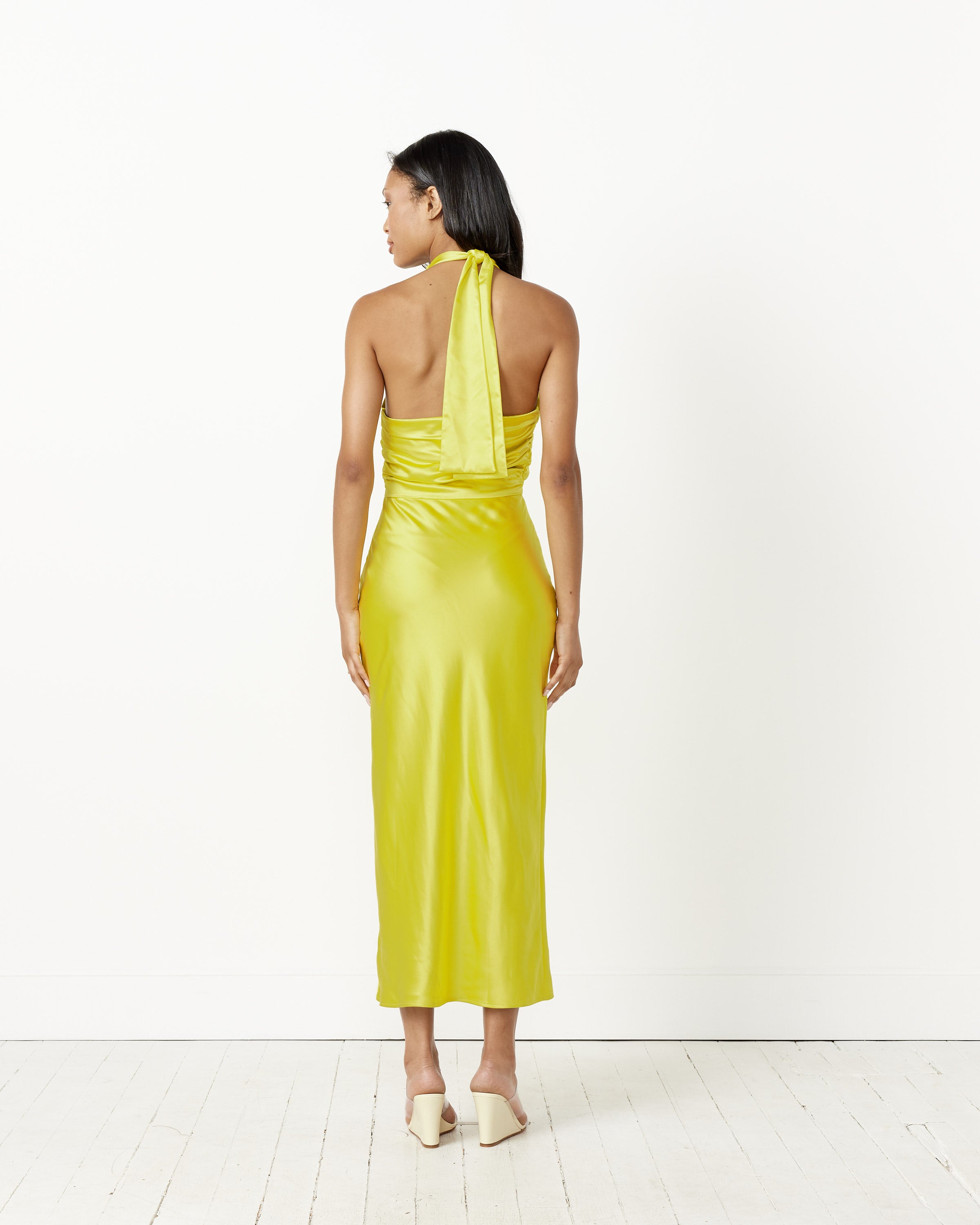simon miller dress SIMONMILLER Black Spiral Maxi Long sleeve crepe dress with high polish chrome buttons creating a keyhole diagonal slit Sculpty Strapless Sequin Dress In